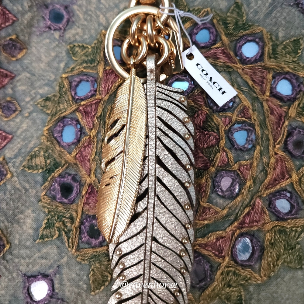 Coach platinum and gold feather charm/key fob